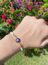 circle blue glass evil eye bracelet on wrist 