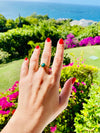 rough emerald gold plated ring on hand 