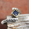 princess-cut-gravity-defyer-floating-blue-stone-twisted-band-silver-ring-2