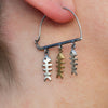 Swim Against the Current Fish Silver Hoop Earrings-model
