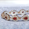 go-ahead-ruby-red-pear-shaped-silver-bracelet