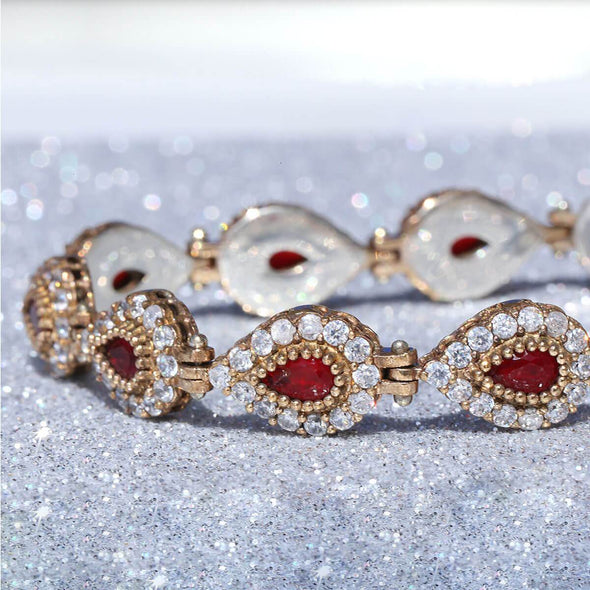 go-ahead-ruby-red-pear-shaped-silver-bracelet