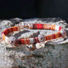 skulls-on-orange-cotton-silver-wave-bracelet