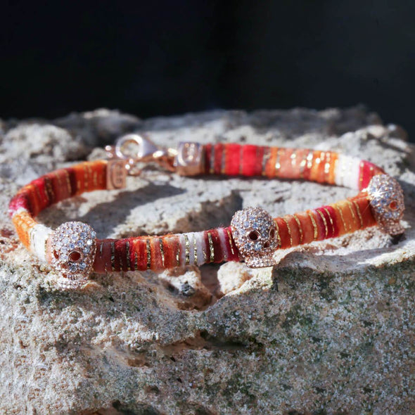 skulls-on-orange-cotton-silver-wave-bracelet