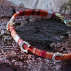 superstitiously-lucky-horseshoe-orange-cotton-silver-wave-bracelet